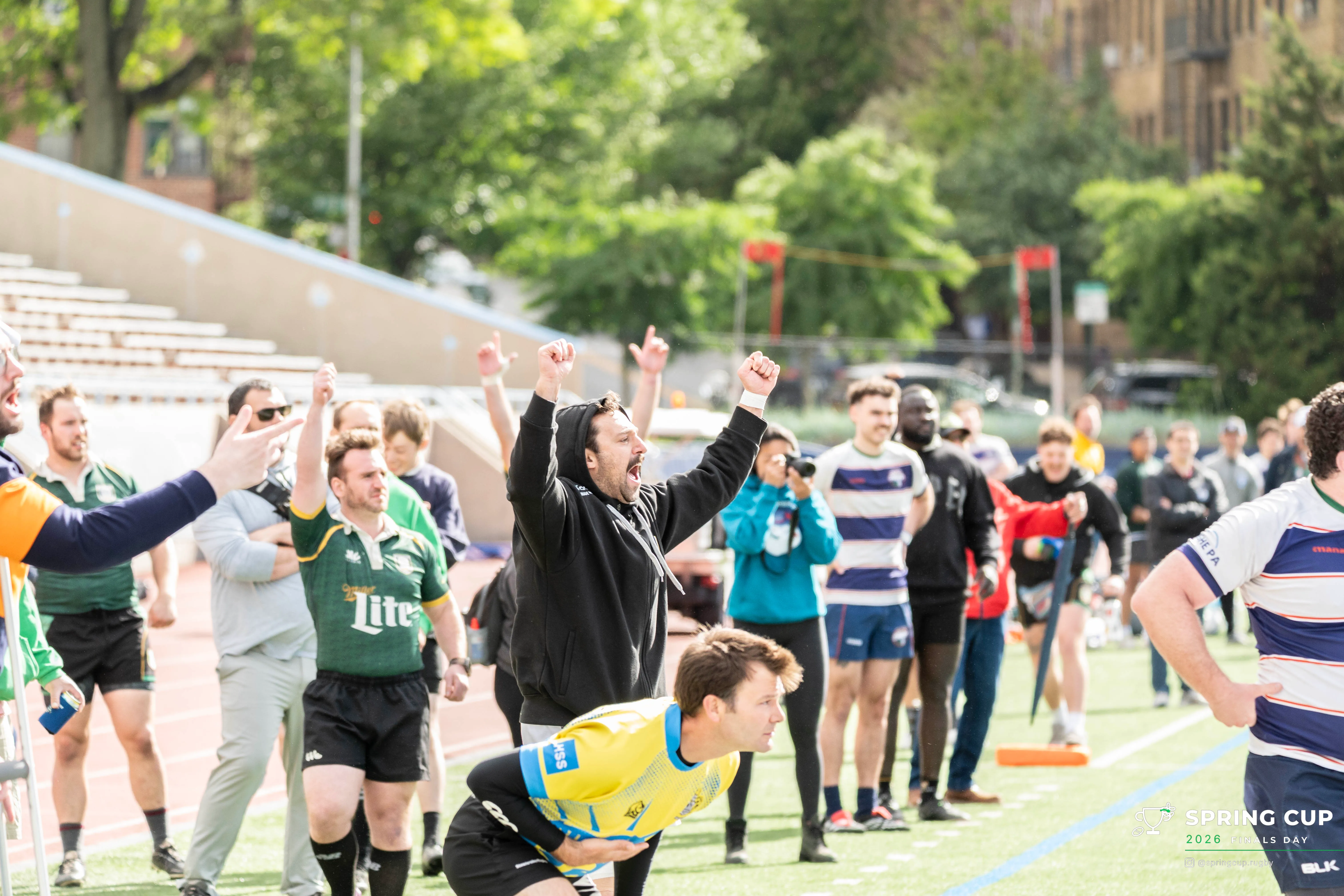 A coach roars in celebration on the touchline